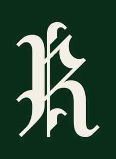The ornate fraktur monogram reversed: cream on forest green.