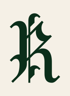 The ornate fraktur monogram in forest green on cream.